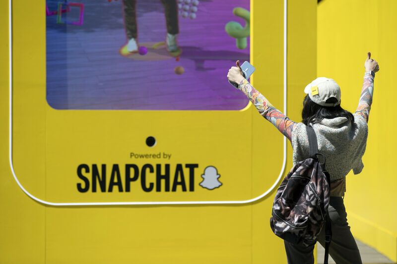 An attendee poses for a photograph at a Snapchat stall during the South by Southwest (SXSW) Sydney festival in Sydney, Australia, on Tuesday, Oct. 17, 2023.