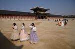 Tourists wear face masks outside Gyeongbokgung palace in Seoul on Feb. 10, 2020.