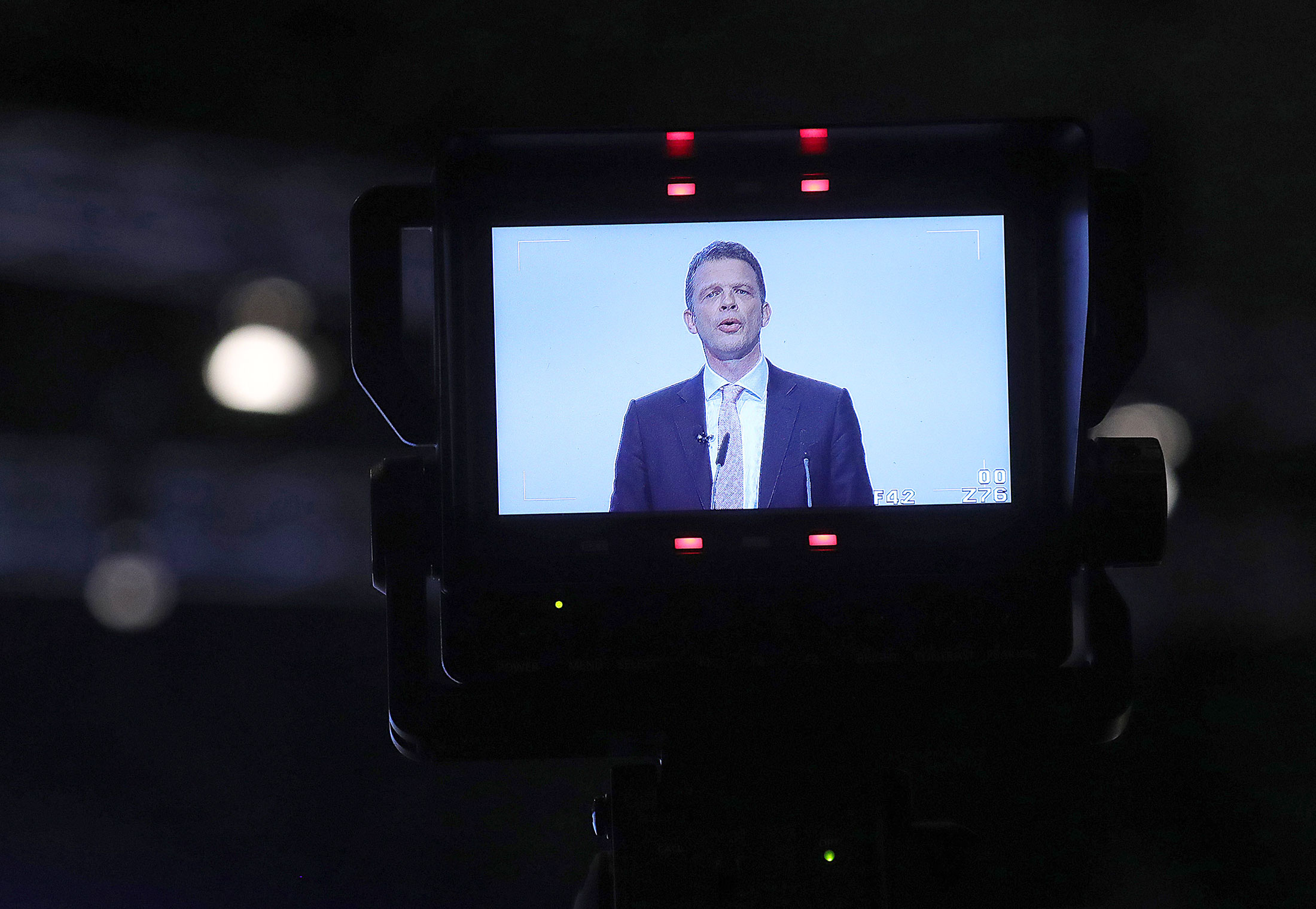 Christian Sewing, chief executive officer of Deutsche Bank AG, is displayed on a television camera monitor as he speaks at the German lender's annual general meeting in Frankfurt.