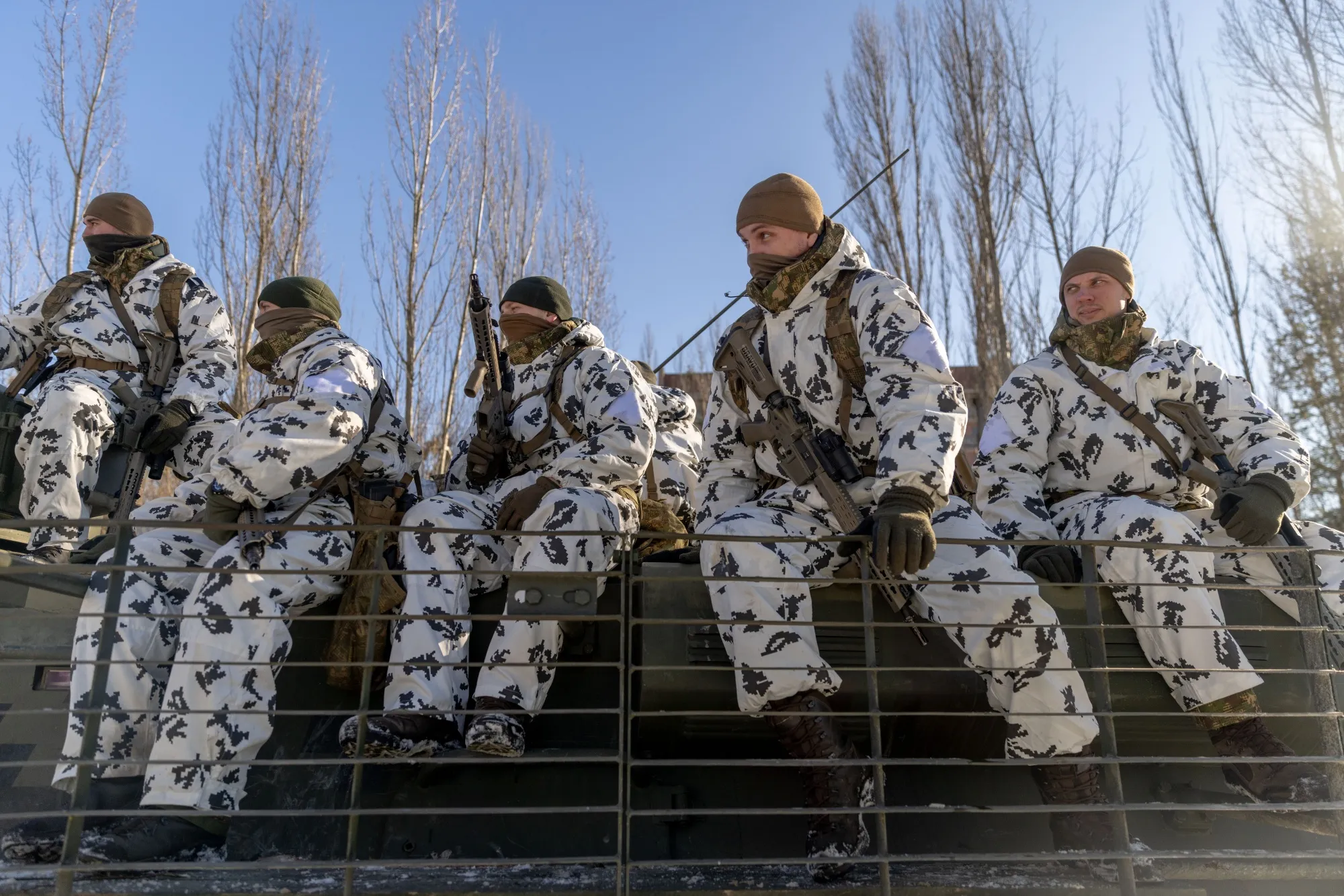 Ukrainian forces arrive in an armored personnel carrier during an urban combat training exercise organized by the Ministry of Internal Affairs, in the abandoned city of Pripyat, Ukraine, on Feb. 4.