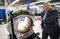 Joseph Paresi, Founder, Chairman and CEO of IDSS explains the inside of the IDSS DETECT 1000 luggage scanner at their headquarters in Boxborough, Massachusetts, U.S., on Friday, Sept. 30, 2016. Photographer: Scott Eisen/Bloomberg