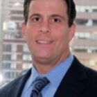 Headshot of John W Polis