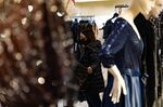 A shopper views gowns for sale at a store inside the King of Prussia mall in King of Prussia, Pennsylvania, U.S., on Saturday, Dec. 4, 2021. 