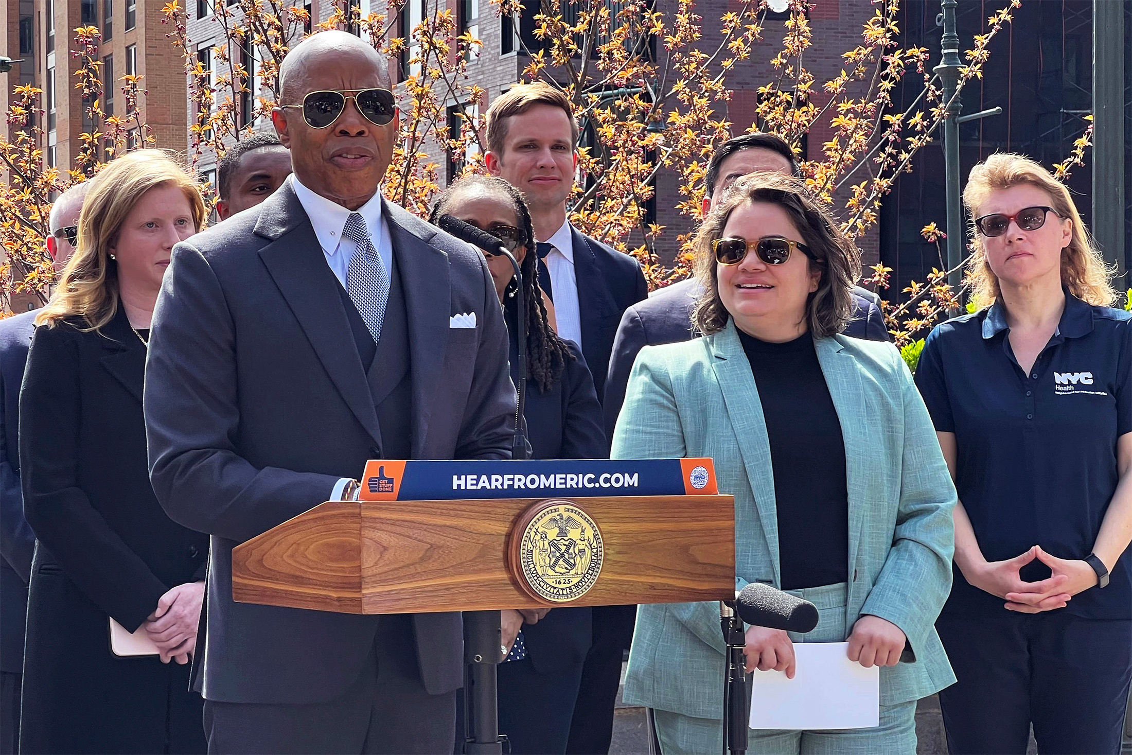 New York Mayor Eric Adams, left, introduces Kathleen Corradi, center, as the city’s first-ever citywide director of rodent mitigation, also known as the rat czar.
