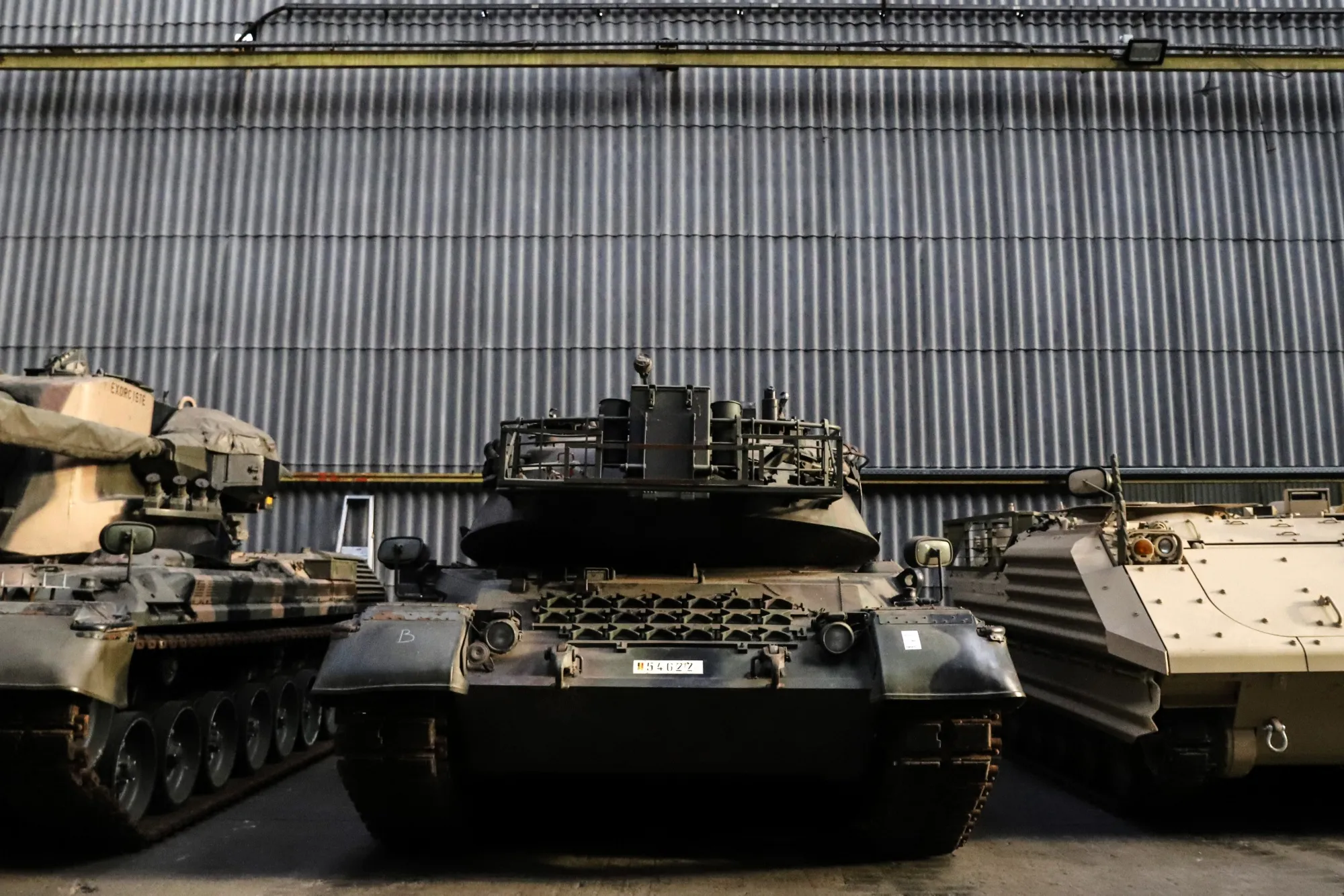A German-made Leopard 1 tank, center, at OIP Land Systems in Tournai, Belgium, in 2023. In a destabilizing, multipolar world, defense stocks are becoming a safe bet for investors.