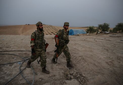 Members of the FSA patrol the Kaklijah village of Jarabulus on Aug. 24.