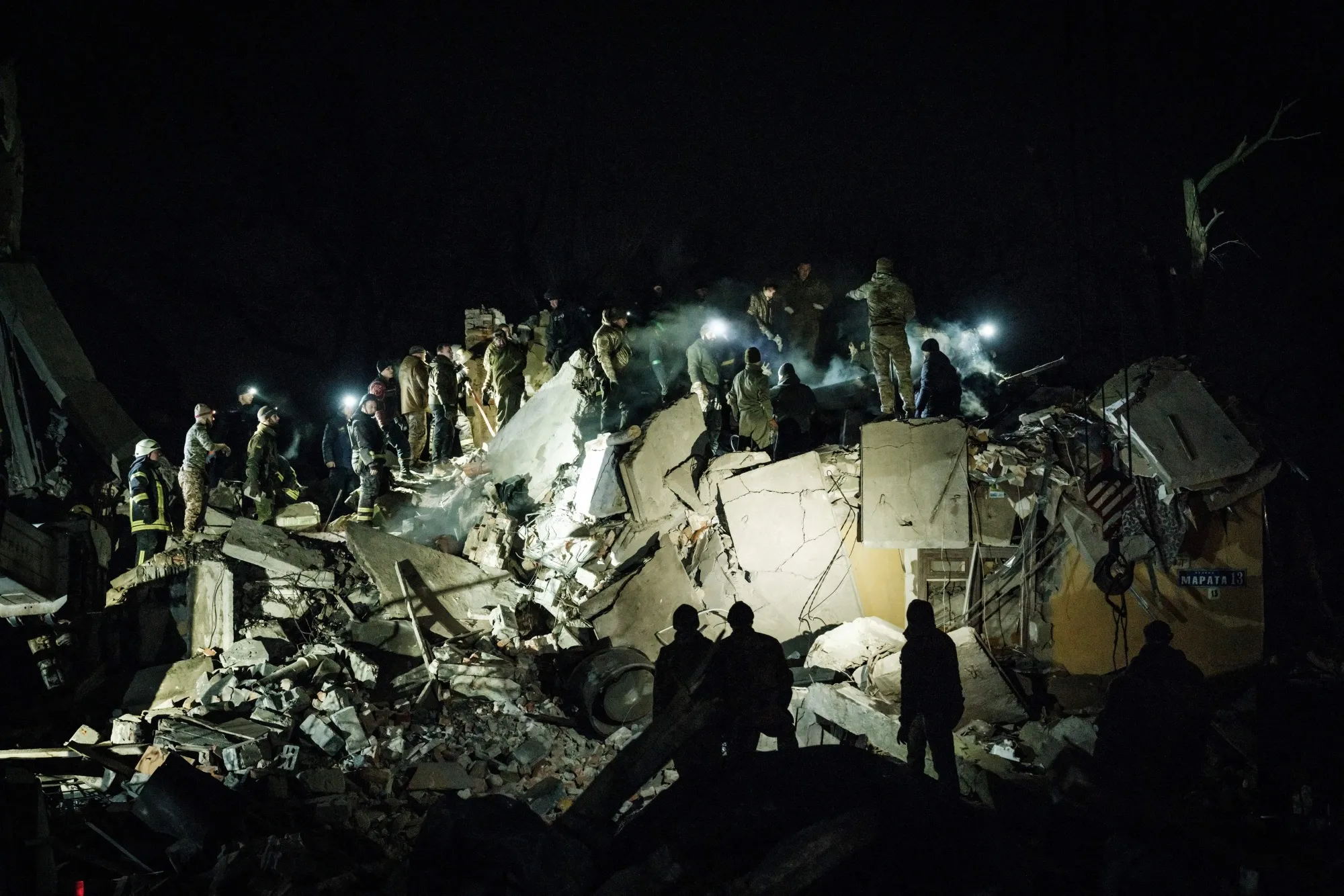 Rescue workers at the scene of a destroyed apartment building following a Russian strike, in Kramatorsk, Ukraine, on Feb. 1.