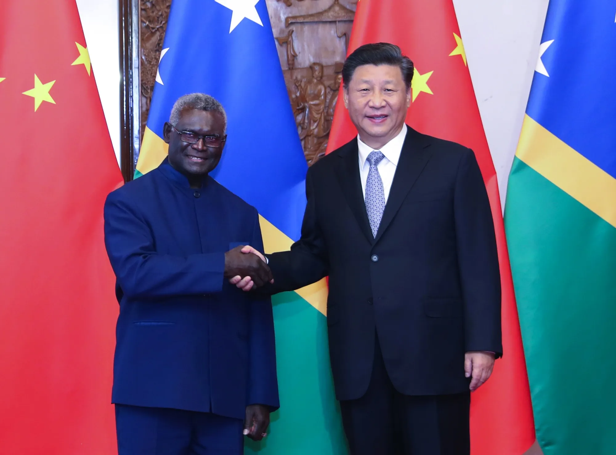 Solomon Islands' Prime Minister Manasseh Sogavare meeting President Xi Jinping of China in 2019.