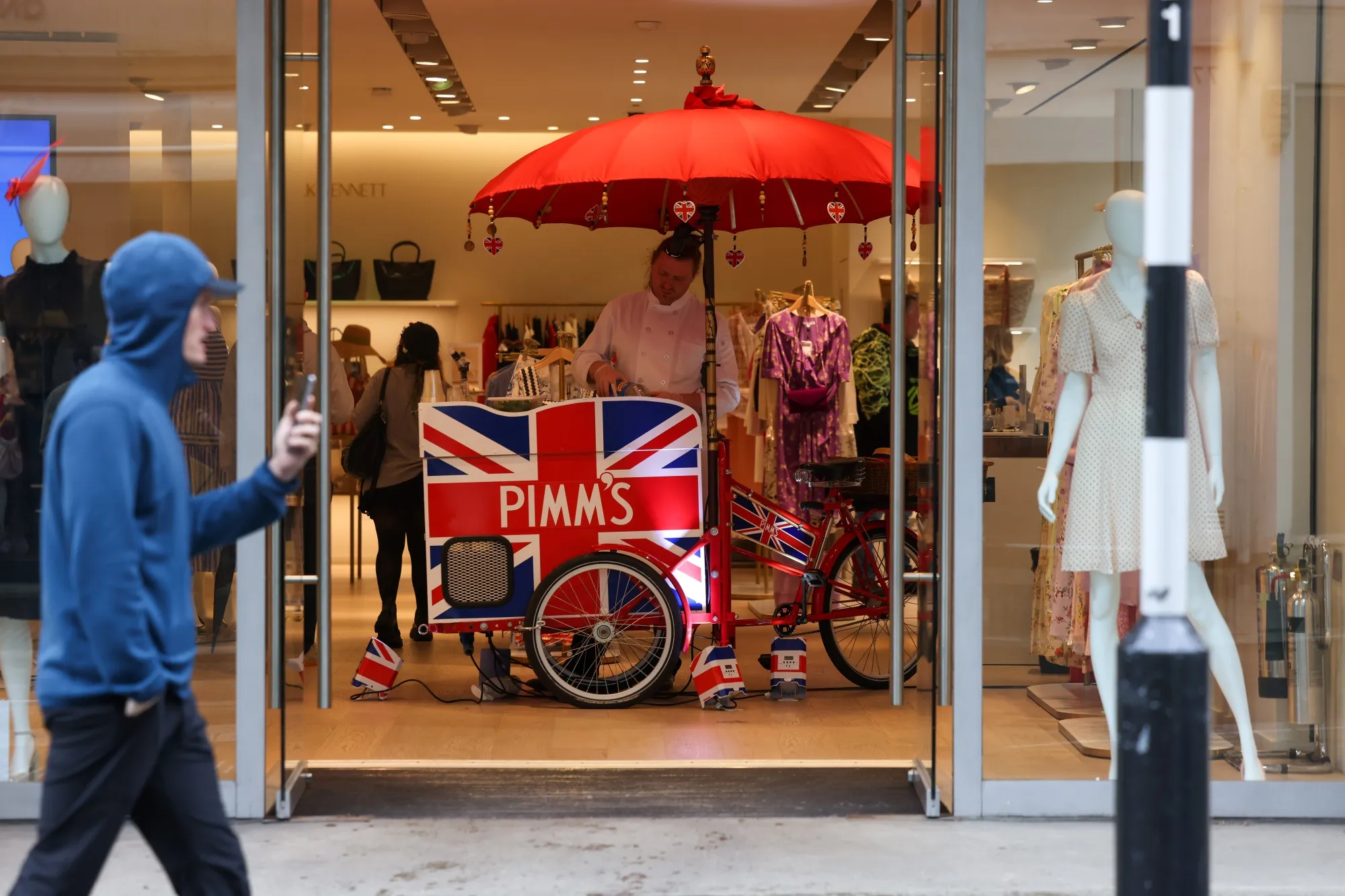A stall serving Pimm's inside the L.K. Bennett store on New Bond Street, on the day of the coronation of King Charles III, in London.
