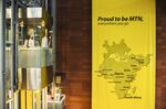 A map of company operations hangs on a wall near a glass elevator at MTN Group Ltd.'s headquarters in Johannesburg, South Africa.