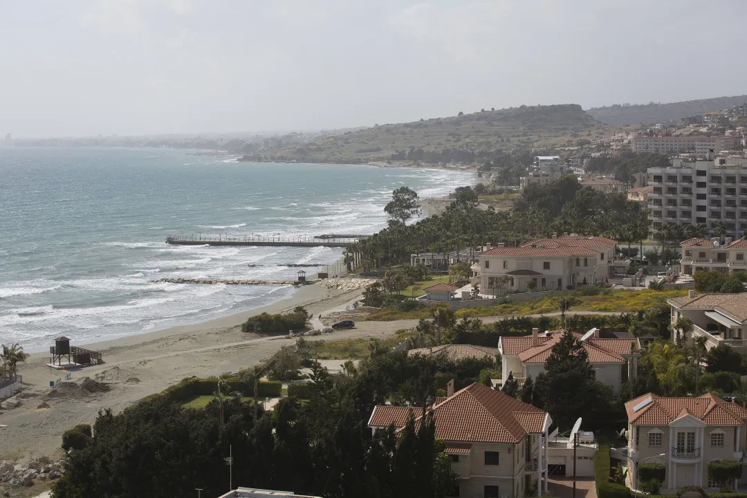 Residential homes and hotels stand along the shoreline in Limassol, Cyprus.