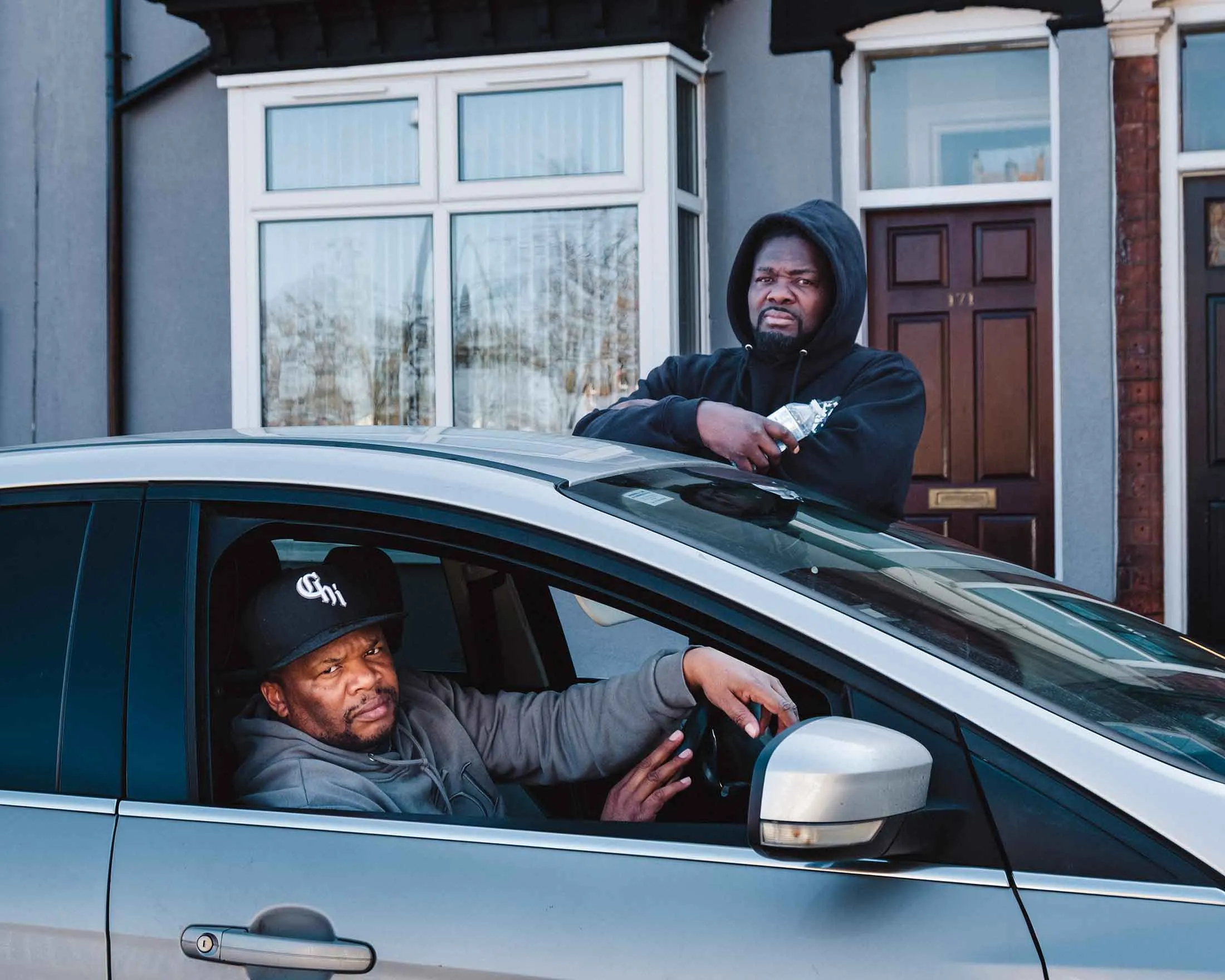 Mr. Brown (left), a self-described “scammer hunter,” and his de facto bodyguard&nbsp;Sting.