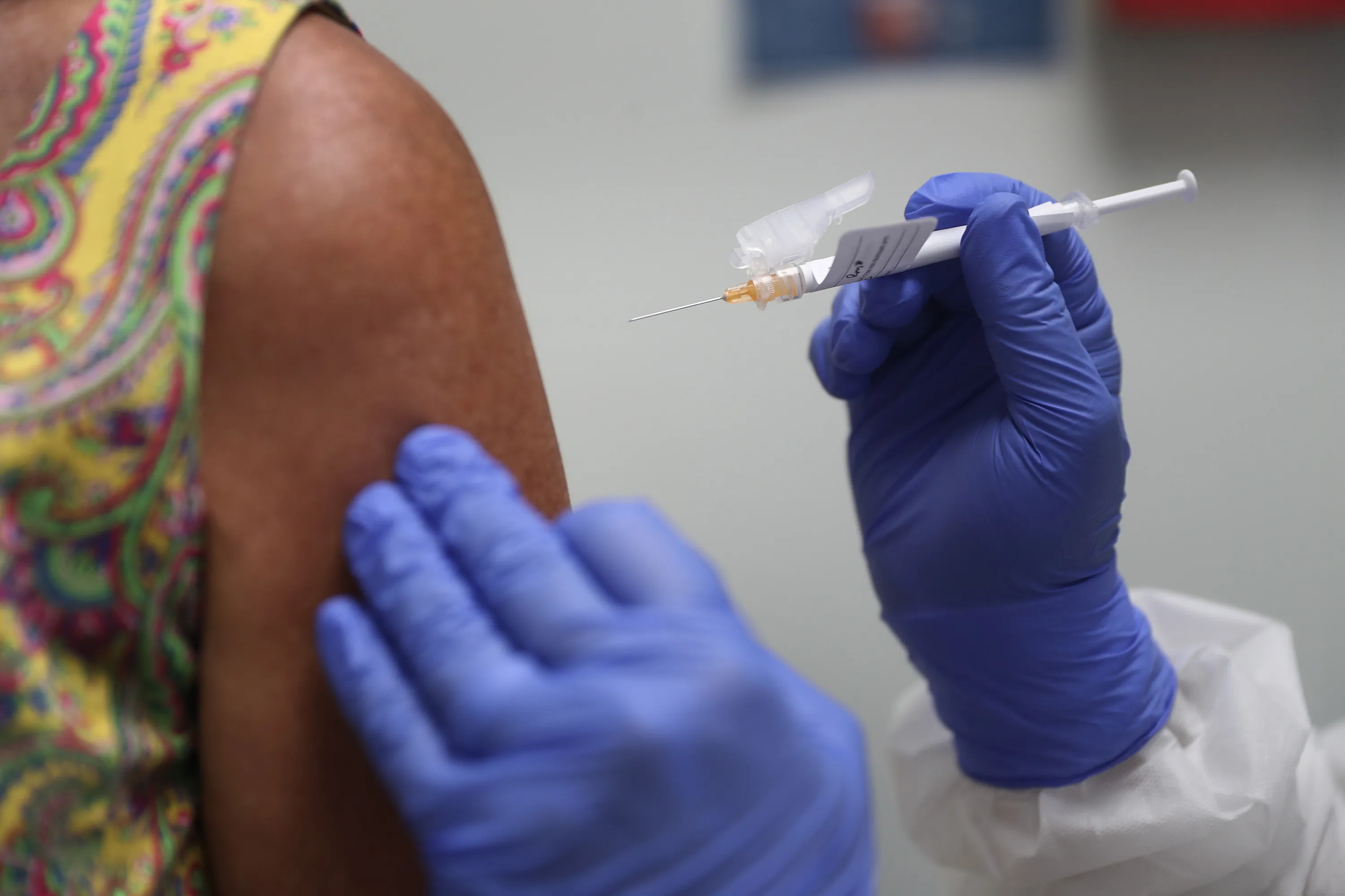 A volunteer receives a COVID-19 vaccination. Would you?