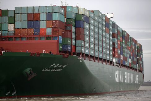 Crew members watch from the deck of the world's largest container ship, the CSCL Globe, operated by China Shipping Container Lines Co., ahead of docking at the Port of Felixstowe, a subsidiary of Hutchison Whampoa Ltd., in Felixstowe, U.K., on Wednesday, Jan. 7, 2015. The inflation rate in the euro area fell below zero for the first time in more than five years, bolstering the case for more European Central Bank stimulus. Photographer: Simon Dawson/Bloomberg