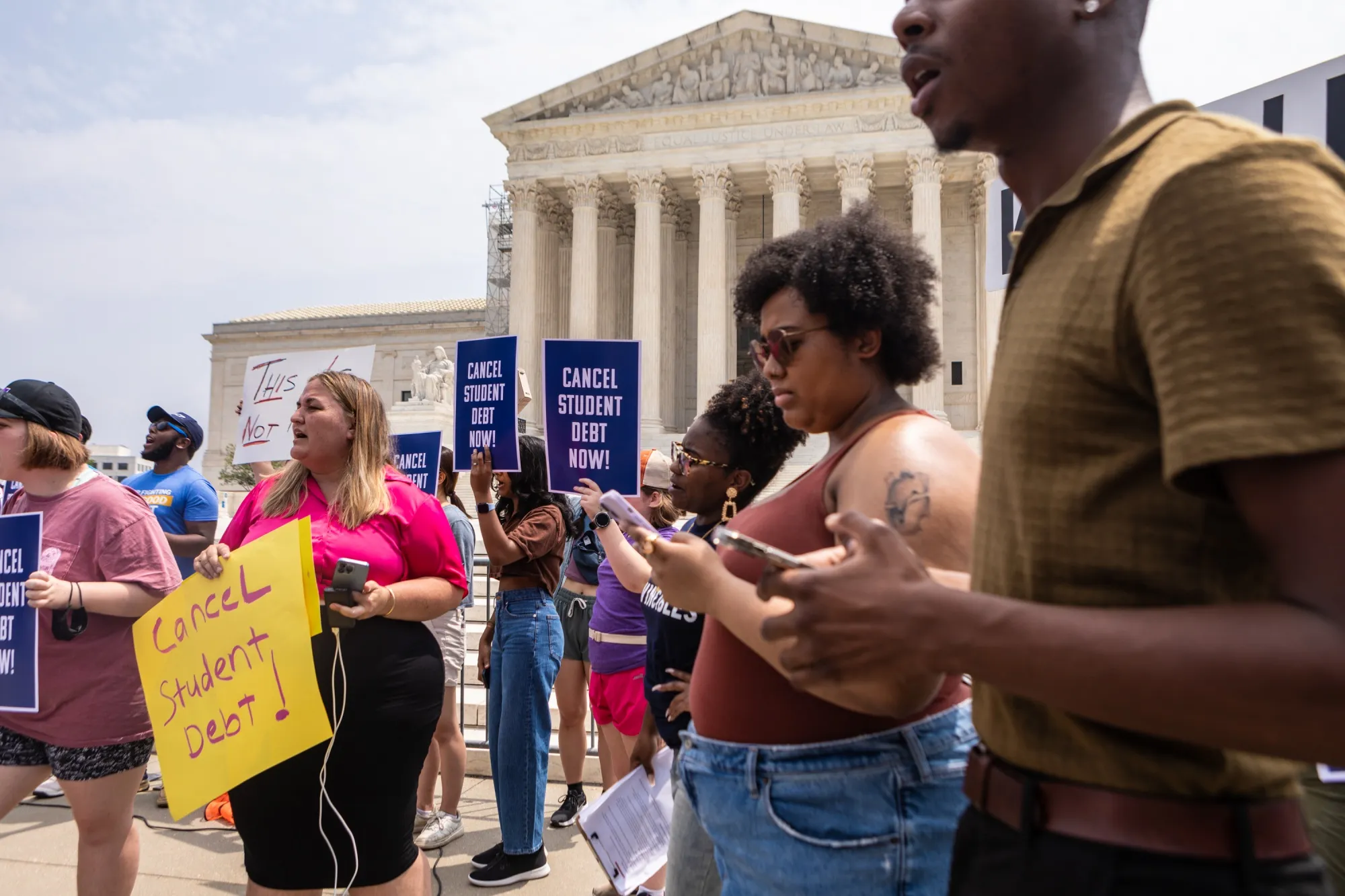 Demonstrators in favor of student loan debt forgiveness rally outside the US Supreme Court in Washington on June 30, 2023. 
