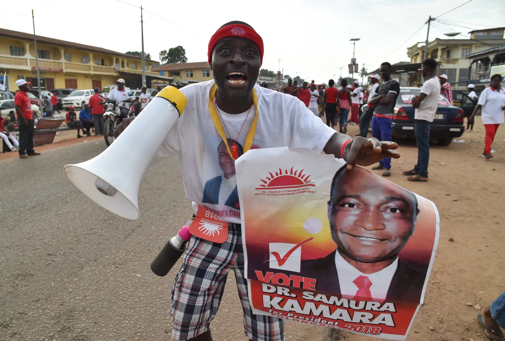 A supporter of Sierra Leone's All People's Congress presidential candidate Samura Kamara cheers during a campaign rally on March 5.