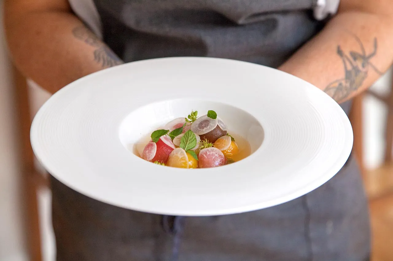 Soft, peeled tomatoes in broth at Brooklyn's Take Root. Photographer: Dominic Perri/Bloomberg