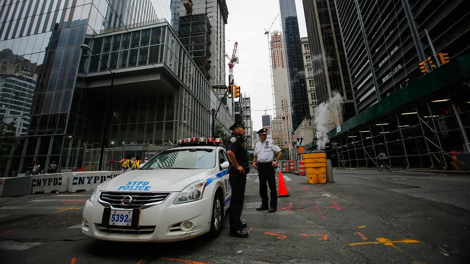 New York Police Officers stand guard at a street near Ground Zero on July 4, 2015 in New York City.
