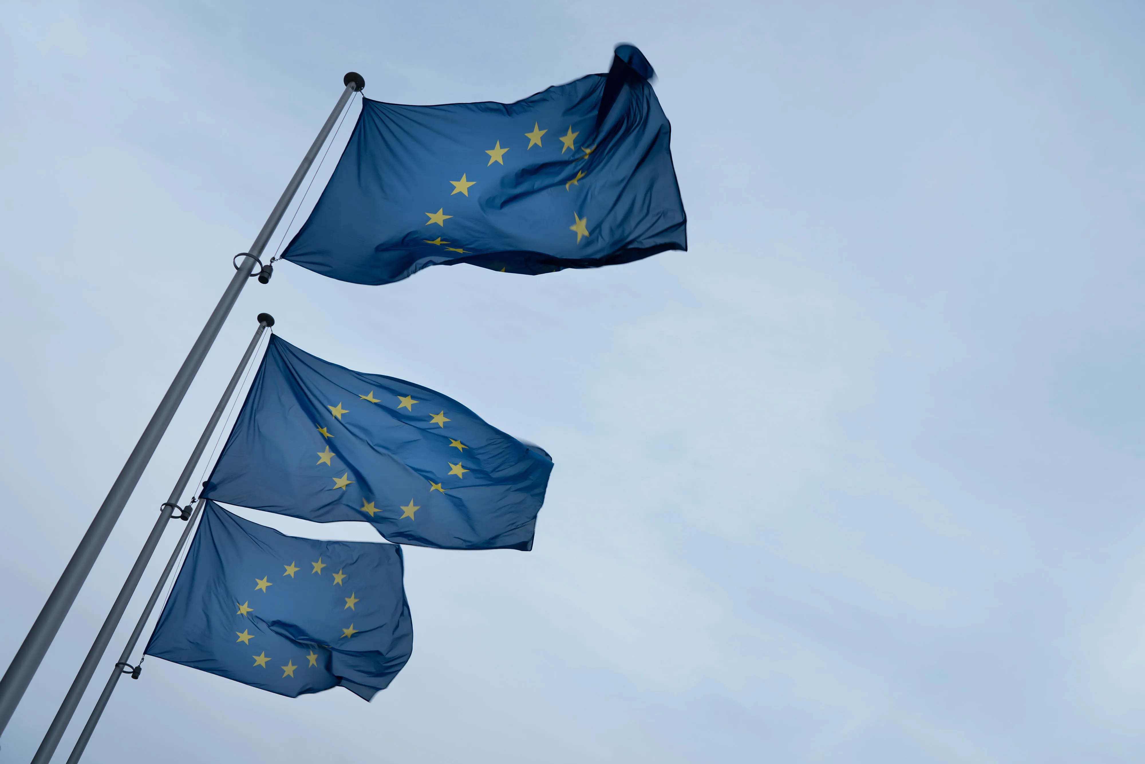 European Union (EU) flags fly from flagpoles outside the Berlaymont building in Brussels, Belgium, on Wednesday, Oct. 9, 2019. The Brexit talks have turned into an angry stalemate, as U.K. and EU leaders focused on blaming each other for refusing to budge.