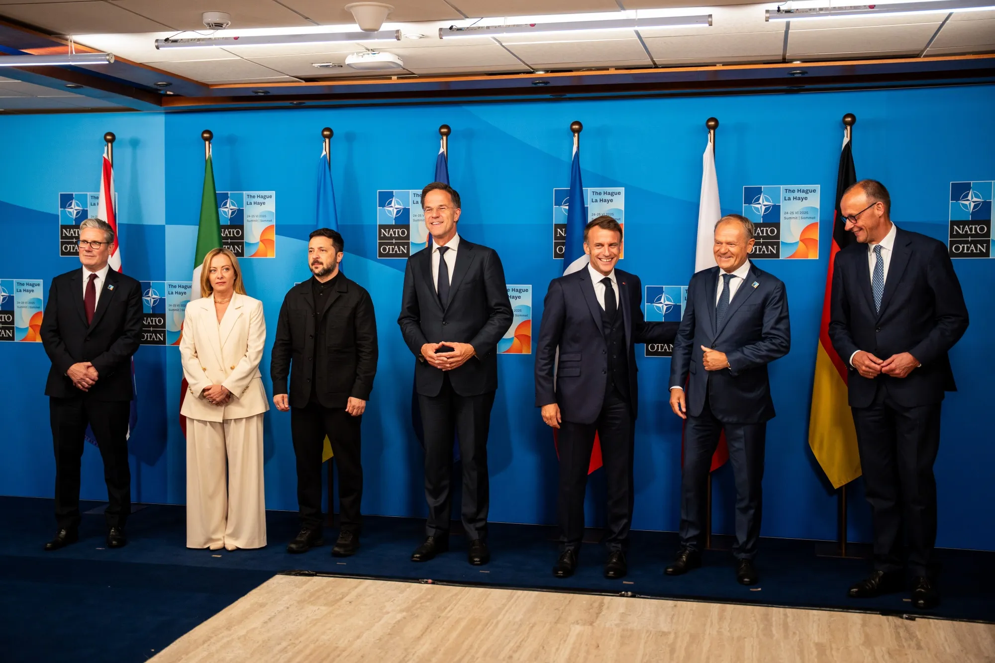 Keir Starmer, Giorgia Meloni, Volodymyr Zelenskiy, Mark Rutte, Emmanuel Macron, Donald Tusk, and Friedrich Merz, left to right, at the NATO summit on June 24.