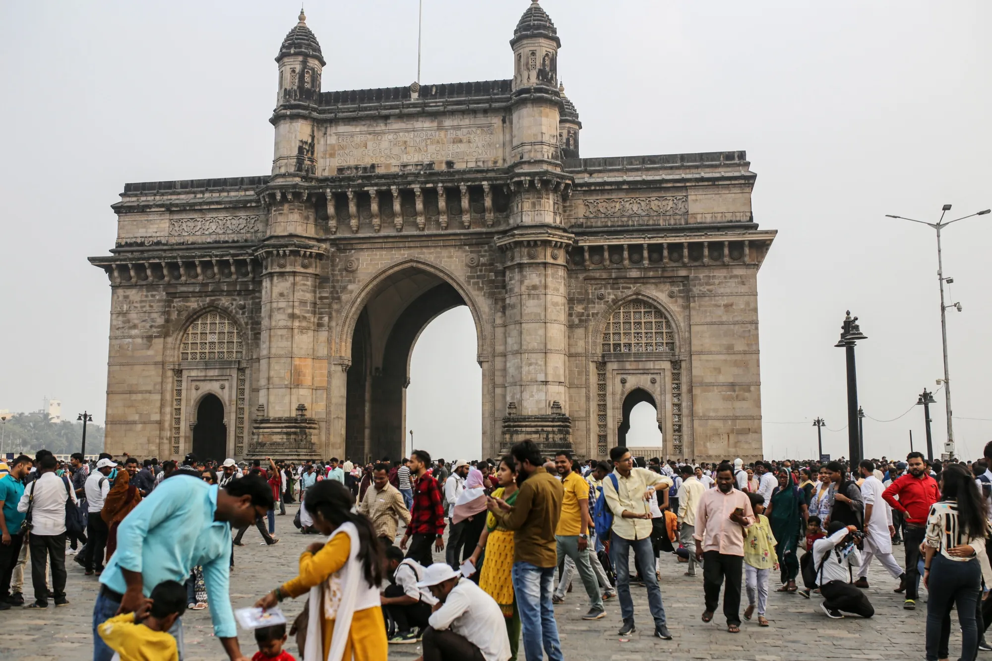 Tourists at the Gateway of India in Mumbai, India.