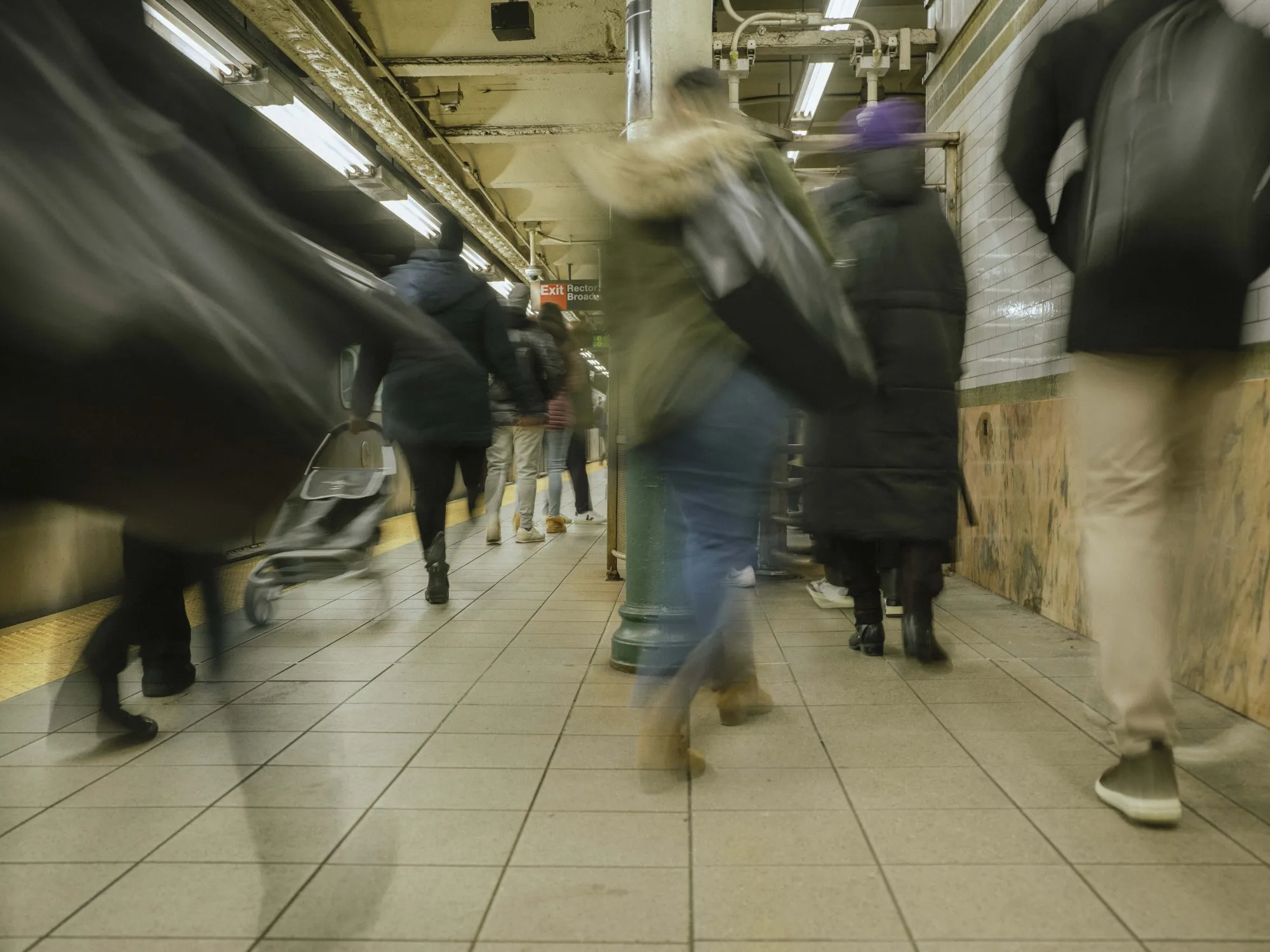 Commuters during morning rush hour at the Wall Street subway station in New York.