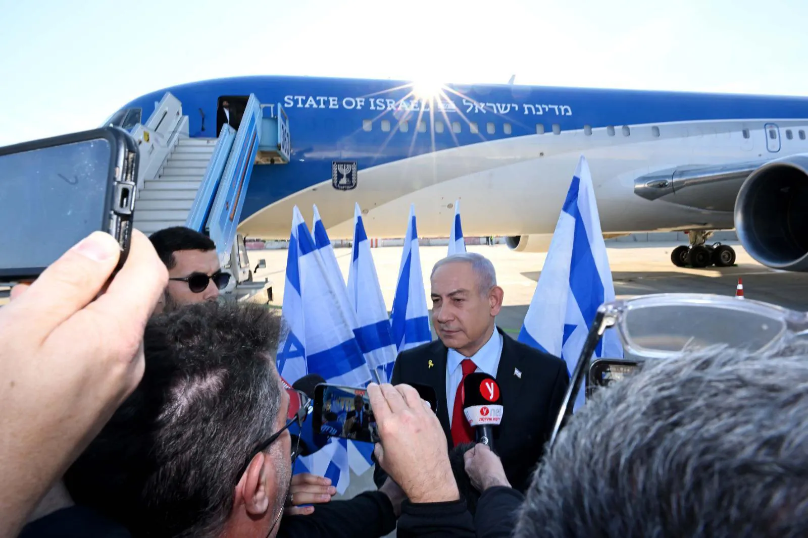 In this handout image from the Israeli Government Press Office, Benjamin Netanyahu speaks to the media before departing for Washington, on Feb. 2.