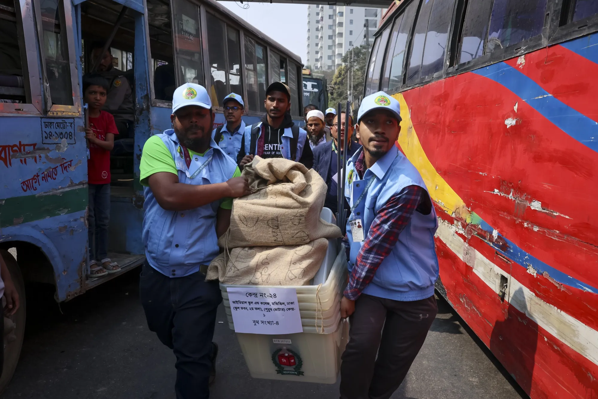 Officials give a final check before dispatching the ballot boxes to voting centers in Dhaka on Feb. 11.