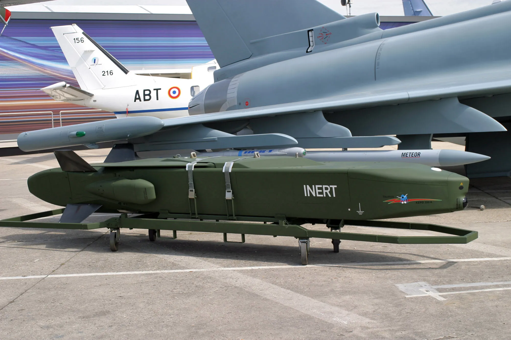 A Taurus missile next to a Eurofighter jet.
