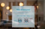 A mask requirement sign outside a store as the indoor mask mandate is reinstated in Philadelphia on April 18.
