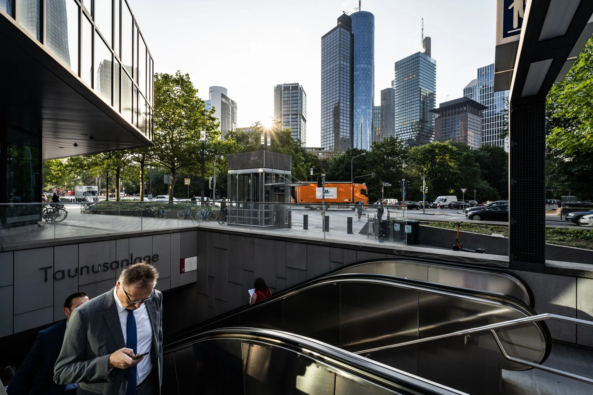 City workers exit the Taunusanlage S-Bahn underground railway station in&nbsp;Frankfurt.