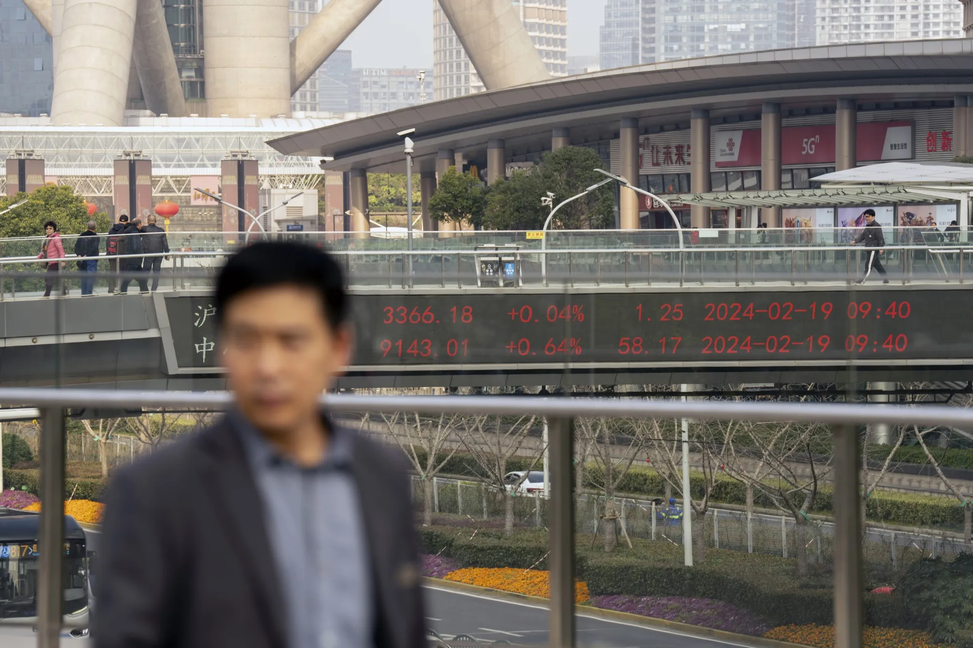 Stock figures in Pudong's Lujiazui Financial District in Shanghai.