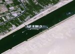 The Ever Given container vessel blocks the Suez Canal on March 25.