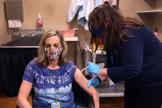 No Vaccine, No Desk: Firms Weigh Whether to Make Shots Mandatory