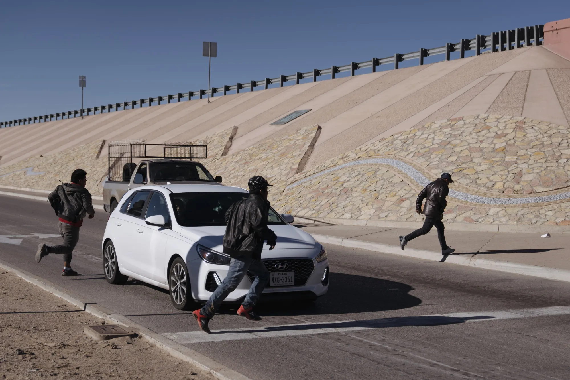 Migrants attempt to evade law enforcement after crossing the US and Mexico border&nbsp;in El Paso.