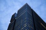 The Mizuho Financial Group Inc. headquarters stands at dusk in Tokyo.