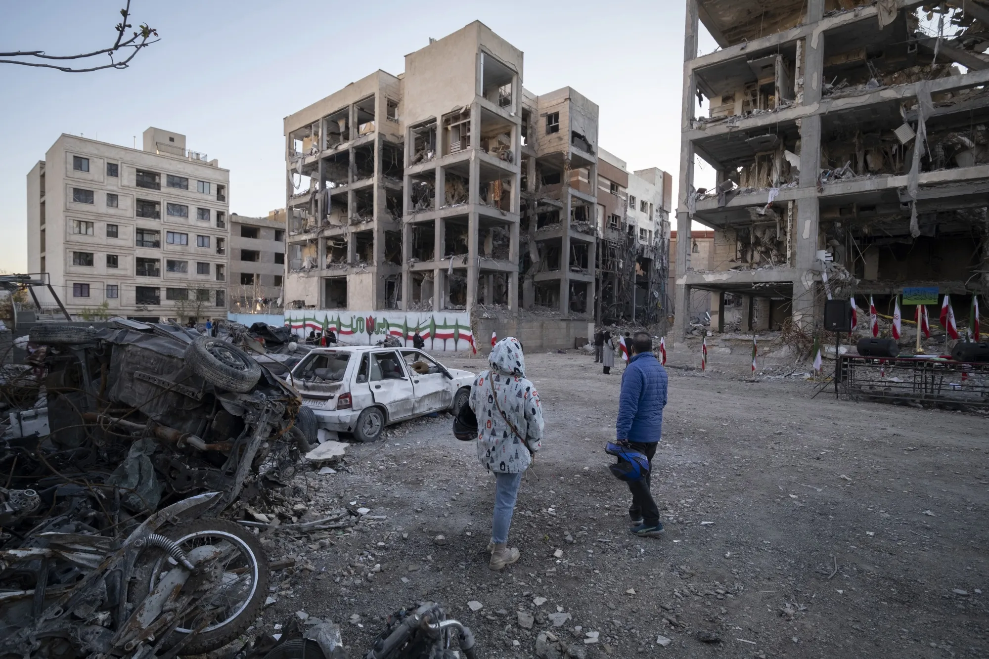 People visit a residential area damaged in airstrikes&nbsp;in Tehran on April 9.