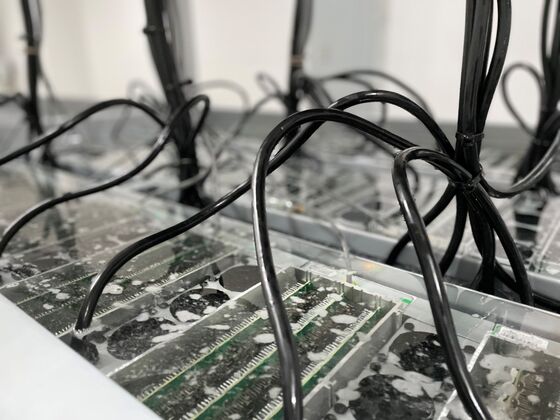 Want Bitcoin Miners to Run Faster? Try Dunking Them In Coolant