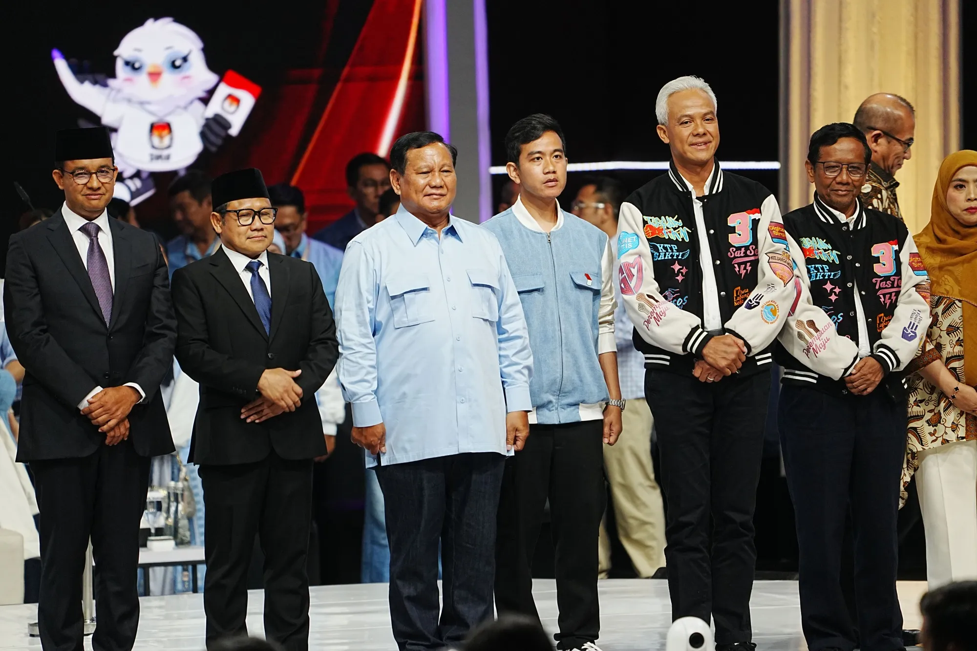 Anies Baswedan, from left, Muhaimin Iskandar, Prabowo Subianto, Gibran Rakabuming Raka, Ganjar Pranowo and Mahfud MD on the stage during the last presidential debate in Jakarta on Sunday.