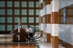 A security guard sits at Brookfield Place in the financial district of Toronto, Ontario, Canada.