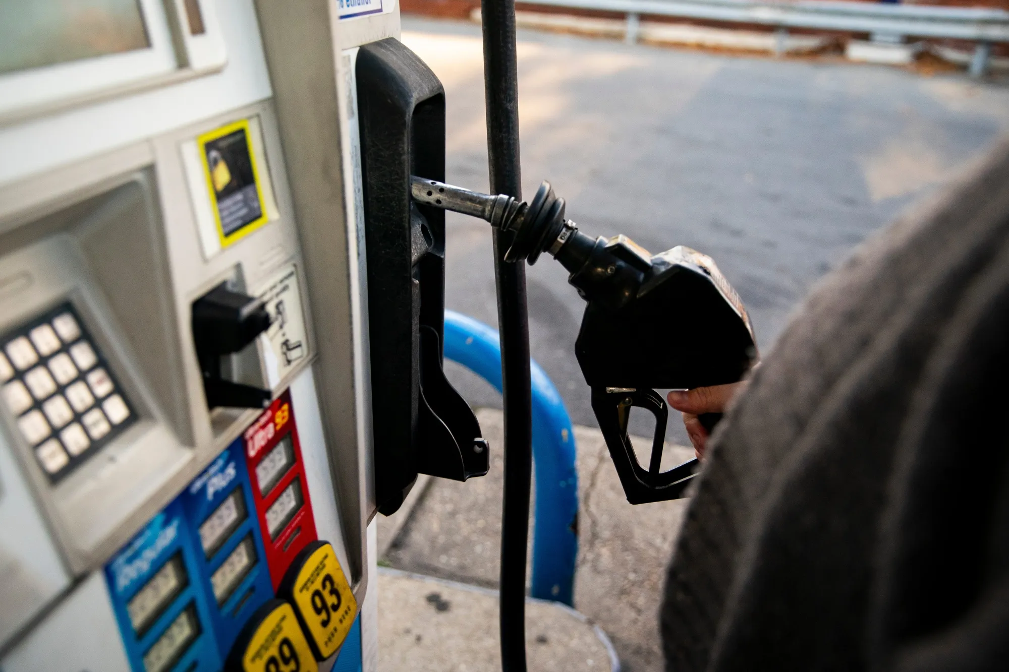 A driver prepares to pump gas at a gas station in Washington, DC.