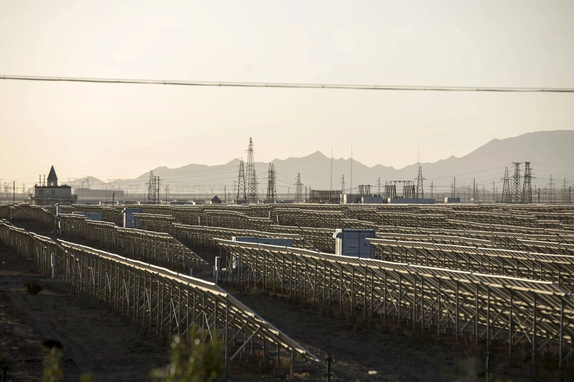 Photovoltaic panels stand at a&nbsp;power station at the Golmud Solar Park on the outskirts of Golmud, Qinghai province, China.