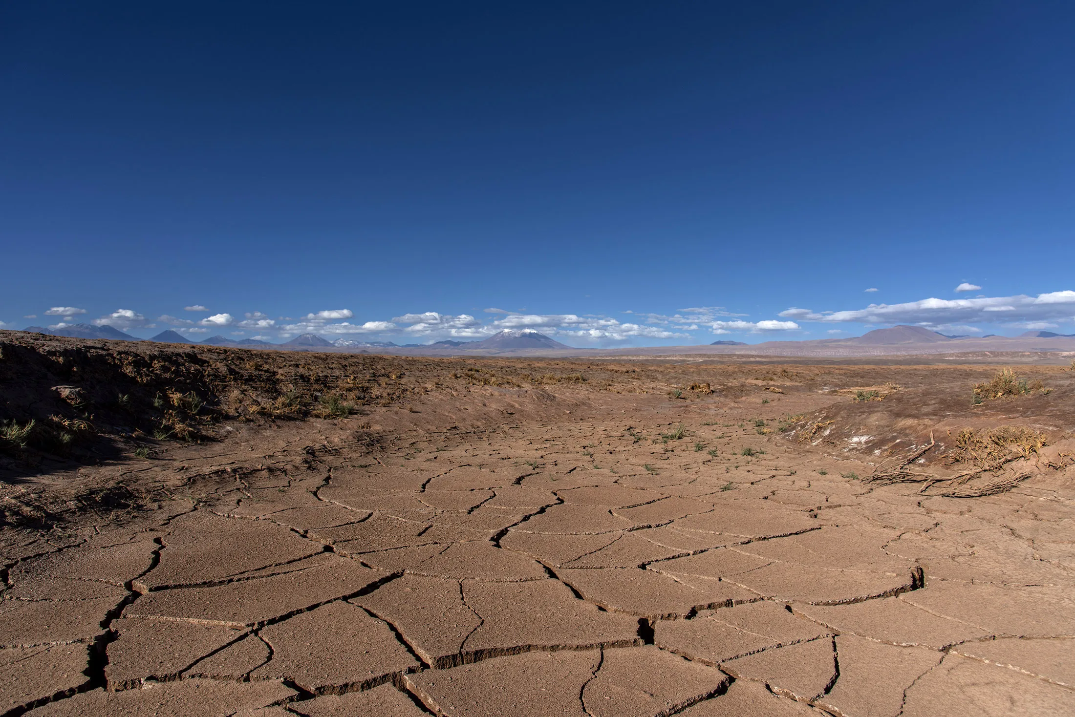 Dry and cracked ground&nbsp;marks an area where water is being pumped by mining companies in the southern tip of the Atacama salt flat.