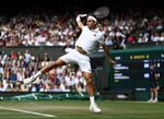 Roger Federer competes during Wimbledon in 2021.