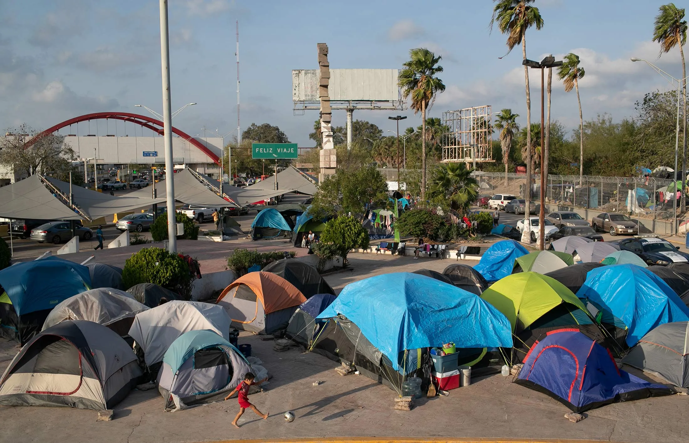 A camp for asylum seekers stands next to the international bridge to the U.S. on Dec. 9, 2019, in Matamoros, Mexico.&nbsp;
