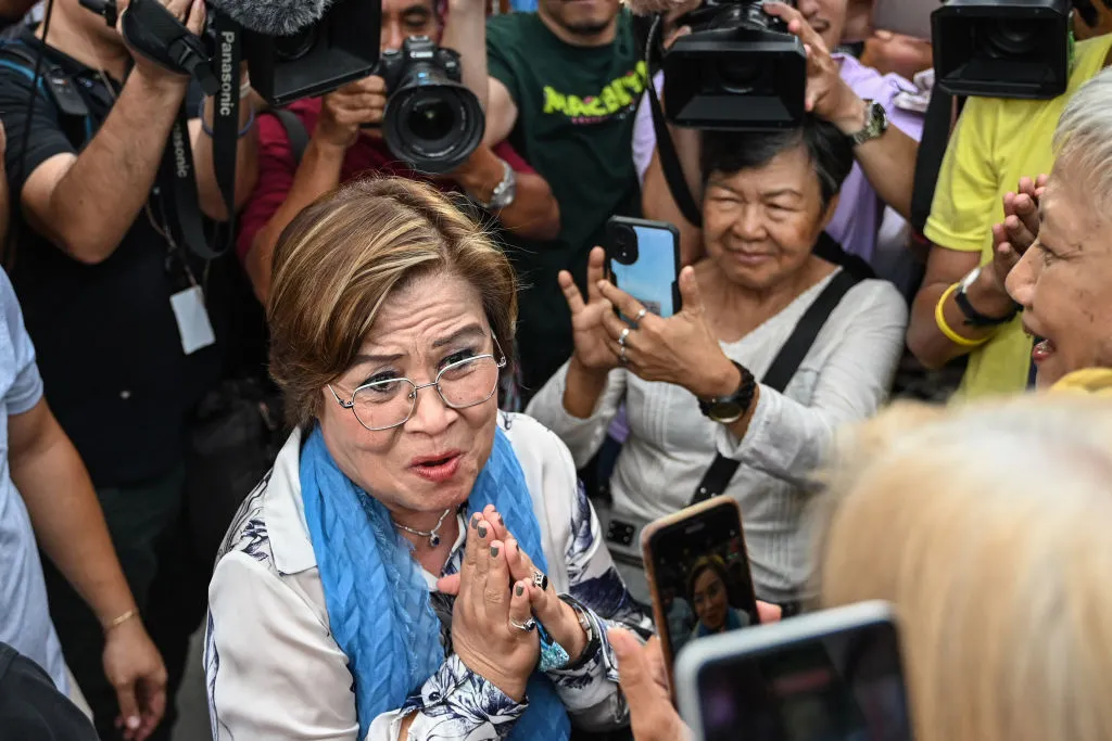 Leila de Lima acknowledges supporters outside a court in&nbsp;Manila, on June 24.
