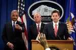 From left: U.S. Attorney General Eric Holder, U.S. Attorney for Western District of Pennsylvania David Hickton, and Assistant Attorney General for National Security John Carlin on May 19 at the Department of Justice in Washington