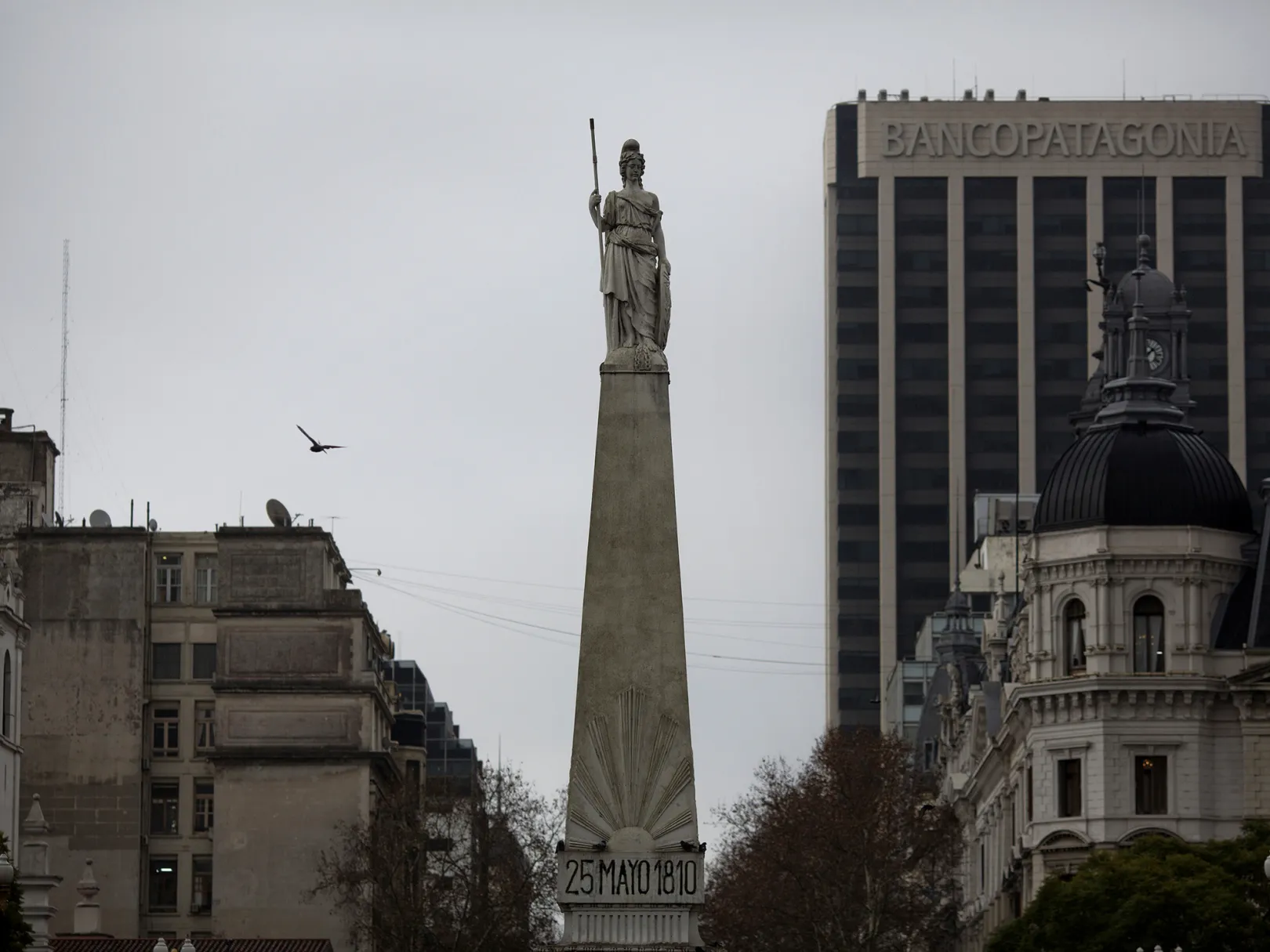 A statue stands over the Plaza de Mayo, marking the scene of the May 25, 1810 revolution, in Buenos Aires, Argentina.