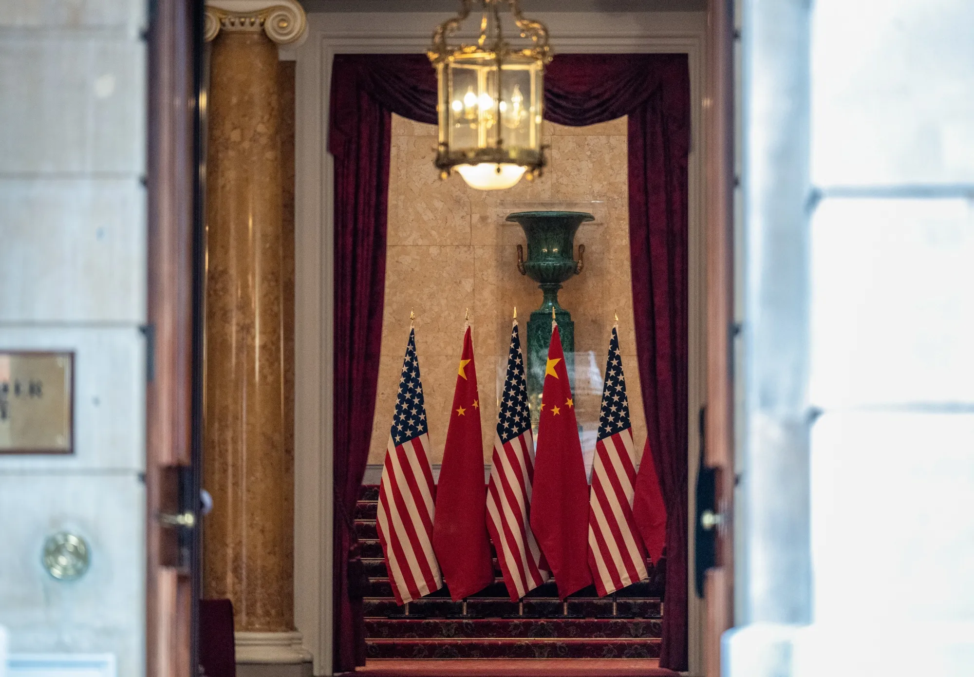 US and Chinese flags in the entrance during trade talks at Lancaster House in London&nbsp;on Tuesday.