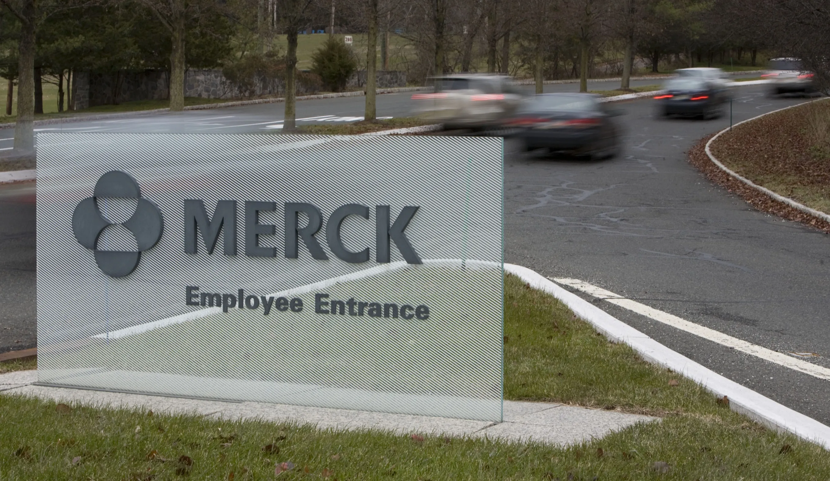 Vehicles enter the campus of Merck headquarters in Whitehouse Station, New Jersey, U.S., on Thursday, Dec. 13, 2007. Merck & Co.'s cholesterol pill Cordaptive failed to win approval from U.S. regulators, less than a week after it was recommended for marketing in the European Union.